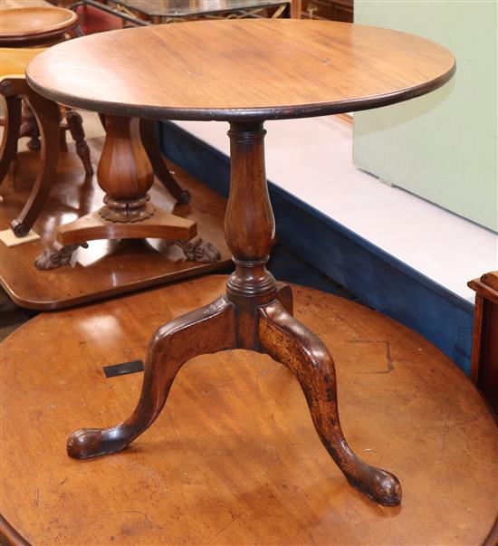 A George III mahogany tilt top tripod table with pad feet 70cm diameter